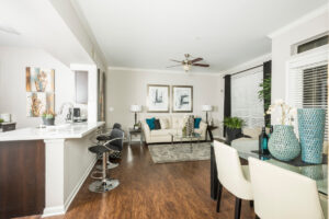 Apartment renovations at Estates at Fountain Lake showcase wide vinyl plank flooring and custom designer paint colors throughout the home, as well as updated kitchens and bathrooms with high-end finishes.