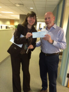 Alan Schachtman, executive vice president of Fifield Cos., presented a $3.1 million check to Kara Breems of the Chicago Department of Planning and Development as part of the city’s Affordable Requirements Ordinance.