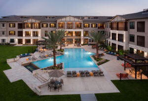 Alexan Auburn Lakes in Houston offers resort-style living with two outdoor pool and sundeck areas enhanced by cabanas and kitchen and grilling areas.