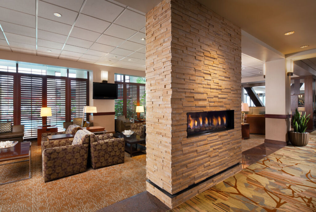 Hotel lobbies have become "engagement centers" that encourage guests to spend more time socializing in common areas, says Waterton COO Mark Zettl.