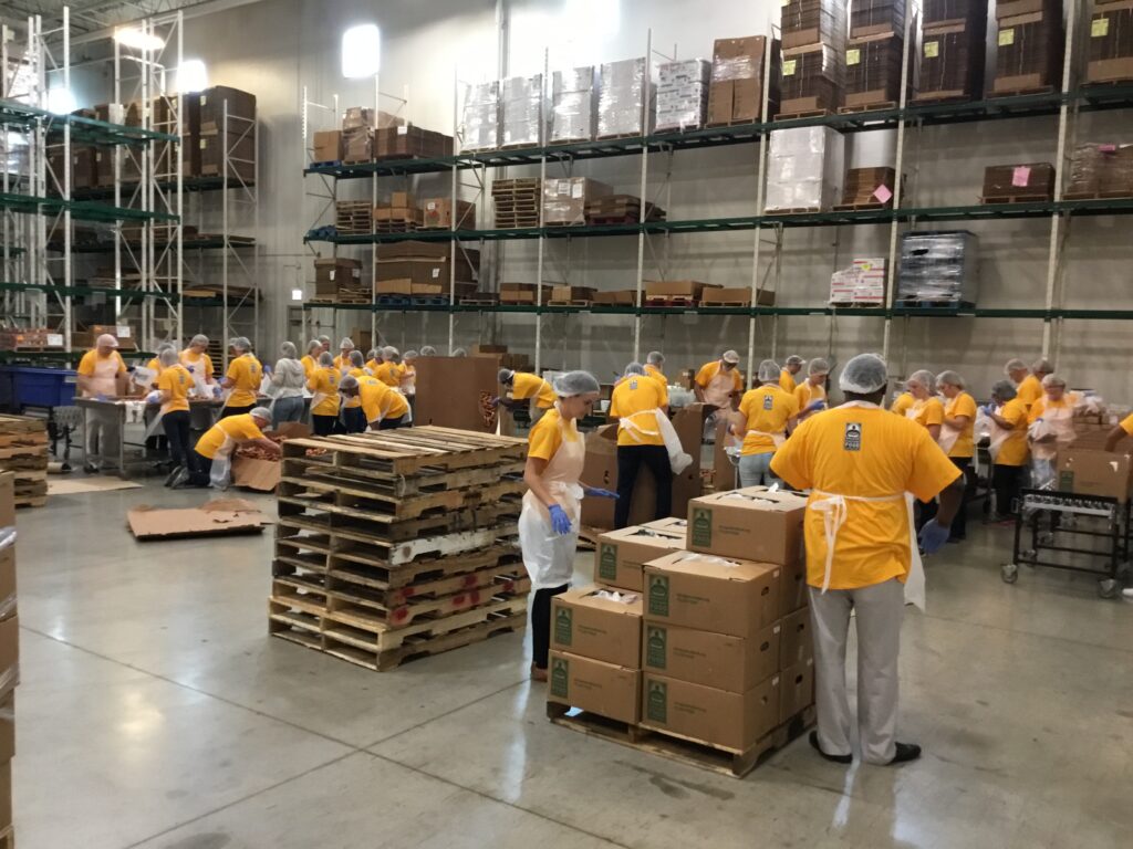 Transwestern employees repacked nearly 9 tons of food for the Greater Chicago Food Depository. The center's services include free meals for area youth during the summer, when just 13 percent of the children who receive subsidized lunches during the school year have access to the district's summer meals program.