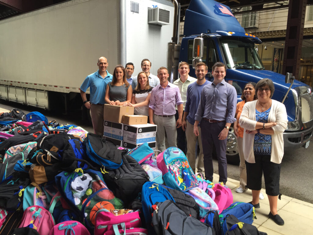 Employees from Chicago-based Draper and Kramer raised money to donate 382 backpacks filled with back-to-school supplies for students at Chicago’s Lawndale Academy. 
