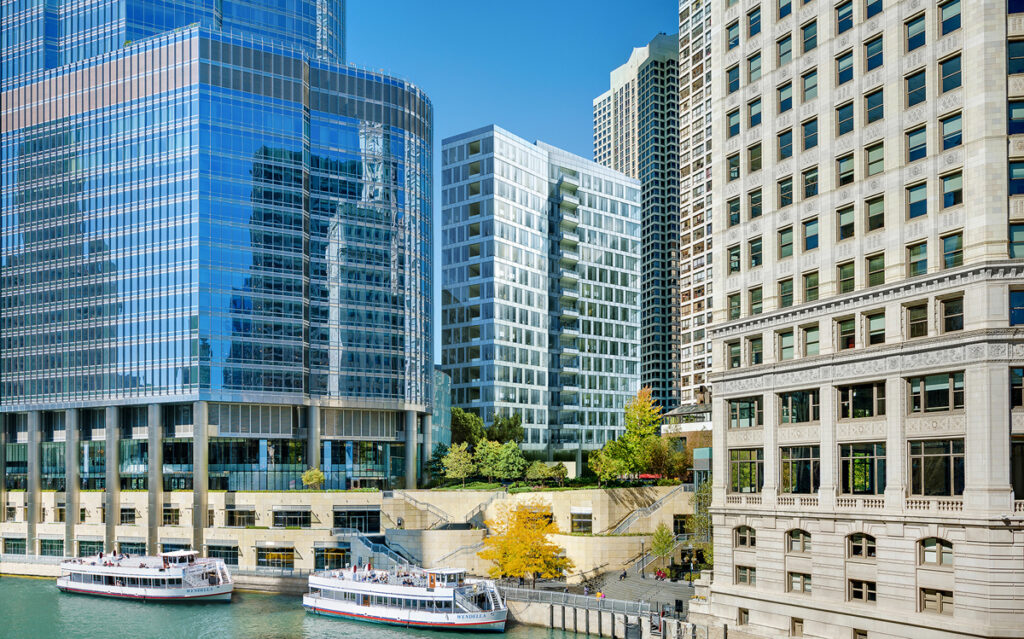 Renelle on the River (center), a new luxury condominium tower from Belgravia Group, is expected to attract second-home buyers for its prime location near the Chicago Riverwalk.