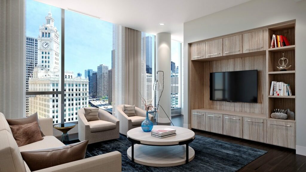 The living area in the A floor plan at Renelle on the River features stunning river and city views.