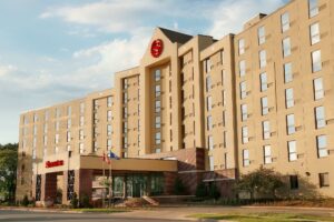 The Sheraton Madison, located 2.5 miles from the University of Wisconsin-Madison campus, is now managed by Waterton.