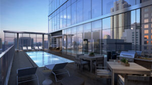 The 24th-floor pool deck at 8 East Huron features an infinity-edge stainless steel pool, sun deck and grilling stations with sweeping views of the surrounding cityscape.