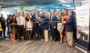 Draper and Kramer Mortgage Corp. employees, Chamber630 members and special guests including Illinois State Rep. David S. Olsen cut the ribbon for the mortgage firm’s new headquarters in Downers Grove, Ill., during a grand opening celebration on August 22.