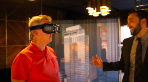 Aaron Galvin from Luxury Living Chicago Realty walks Tom Scott, CEO of CA Ventures, through the VR experience at CA Ventures' newest luxury apartment building, 8 East Huron.